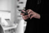 Woman books event ticket on smartphone